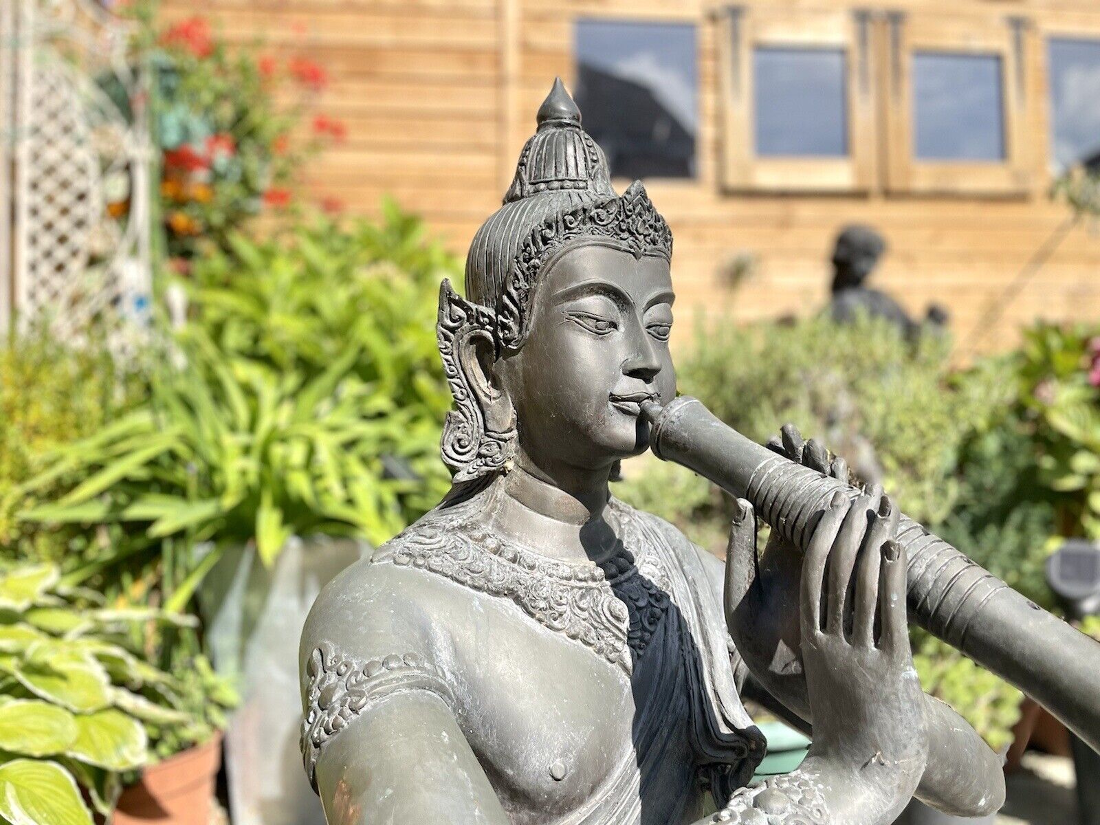 Bronzed Garden Water Feature of a Sitting Deity / Goddess Playing An Instrument