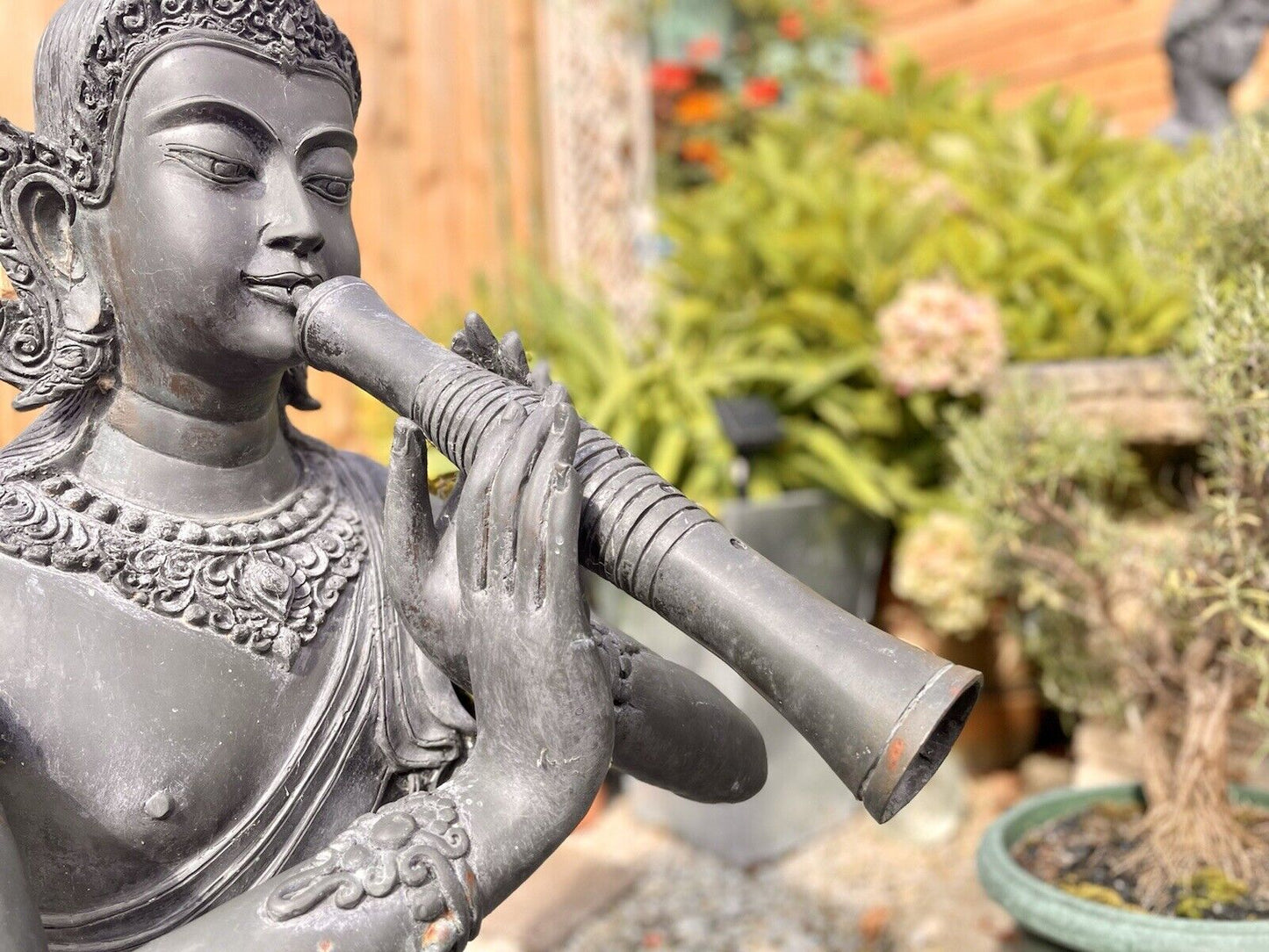 Bronzed Garden Water Feature of a Sitting Deity / Goddess Playing An Instrument
