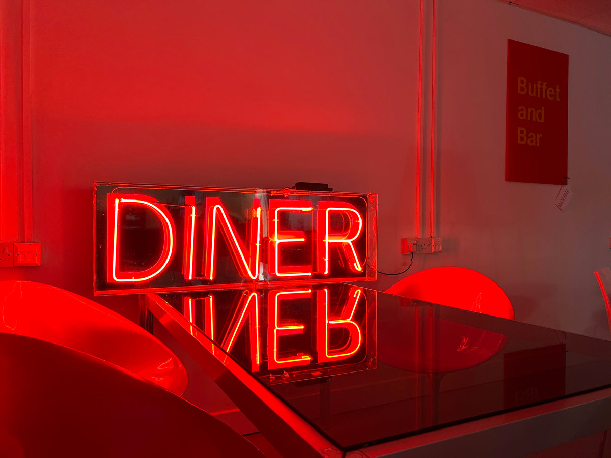 Red neon diner sign available for event, film and photo shoot hire from Hus & Home