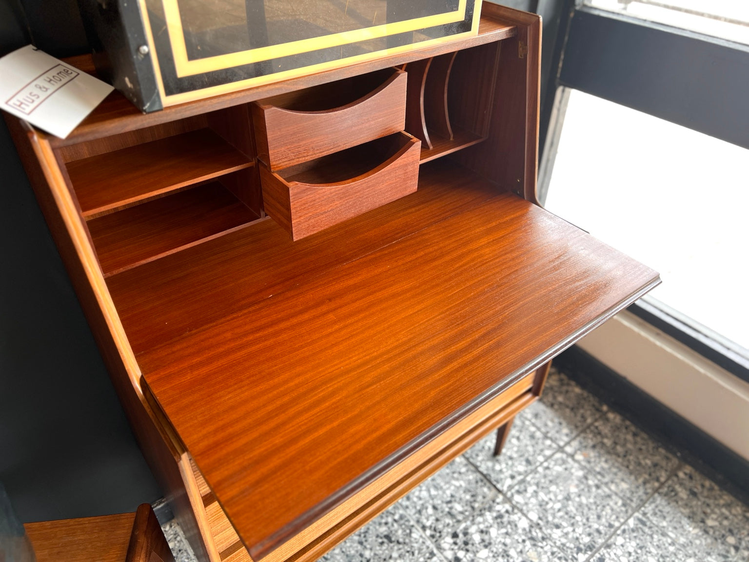 Richard Hornby teak bureau front view closed with drawers