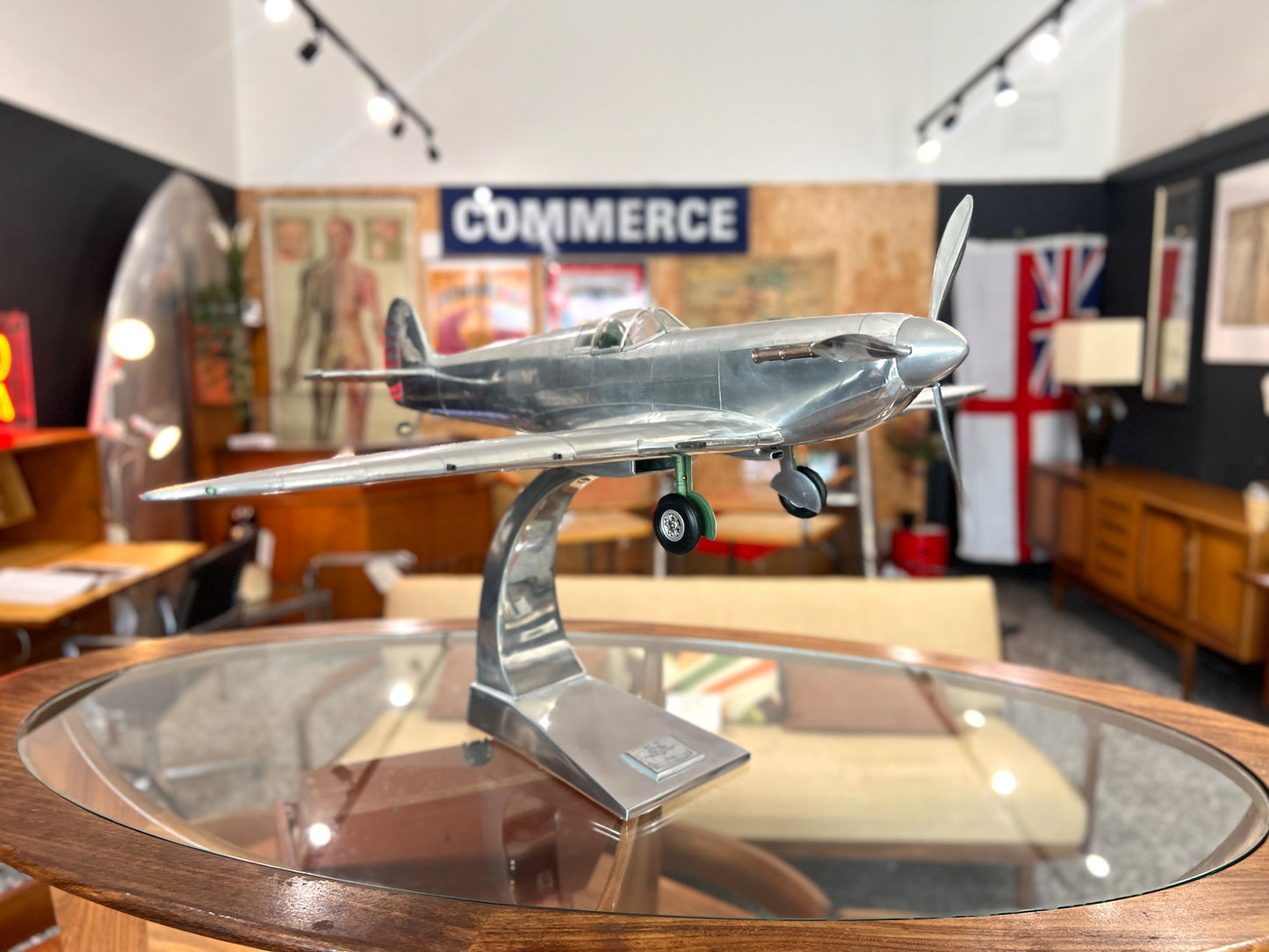 Handcrafted aluminium Spitfire aircraft model side view with landing gear