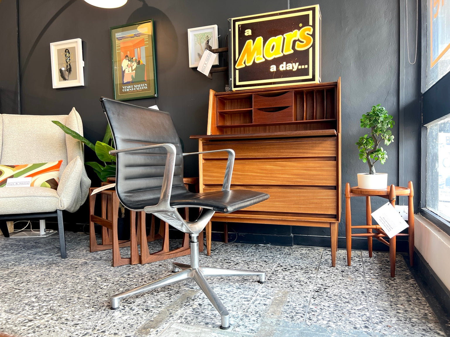 Eames EA108 swivel office chair by ICF in black leather front view