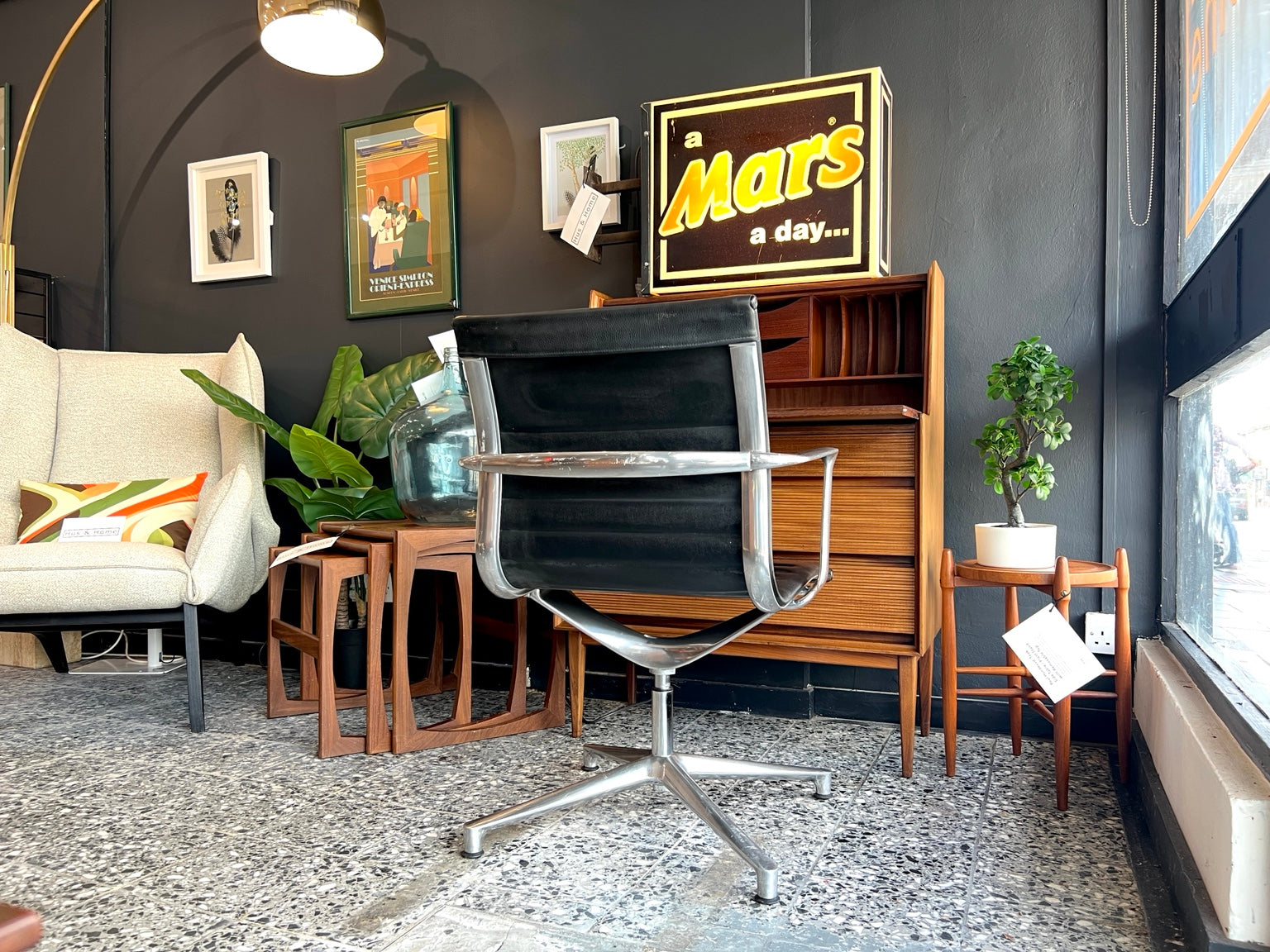 Eames EA108 swivel office chair by ICF in black leather rear view