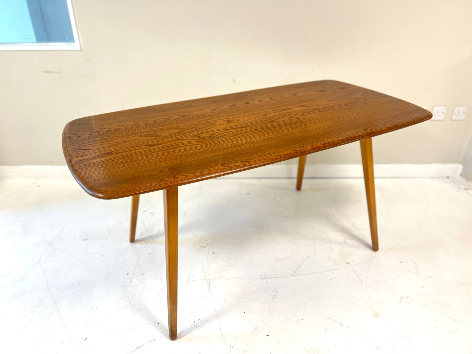 Ercol 382 blonde elm and beech dining table angled view
