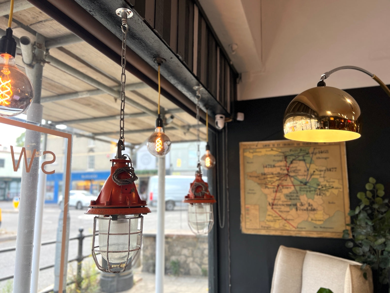 Vintage Russian industrial explosion proof pendant lights hanging in showroom