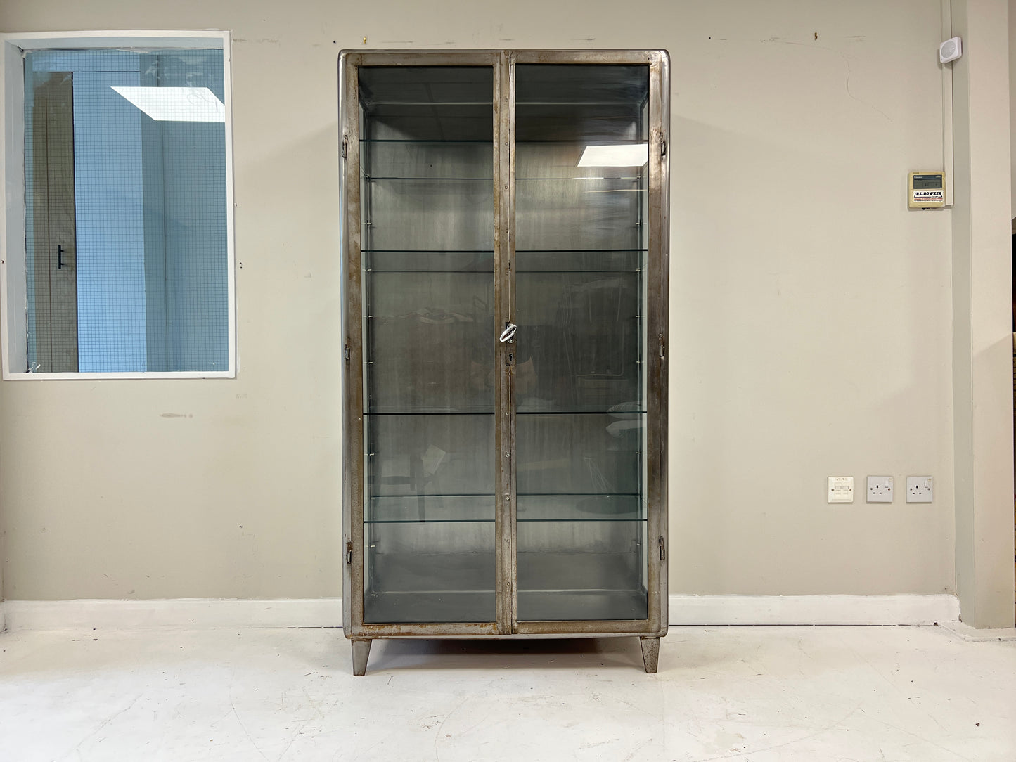 Vintage industrial steel and glass display cabinet