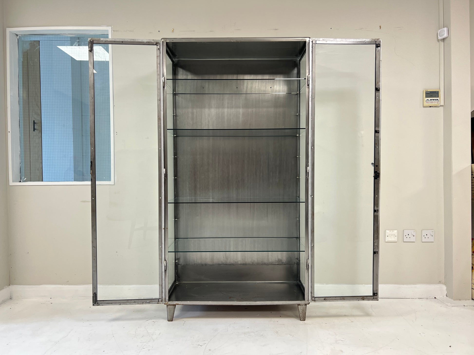 Vintage industrial steel and glass display cabinet detail