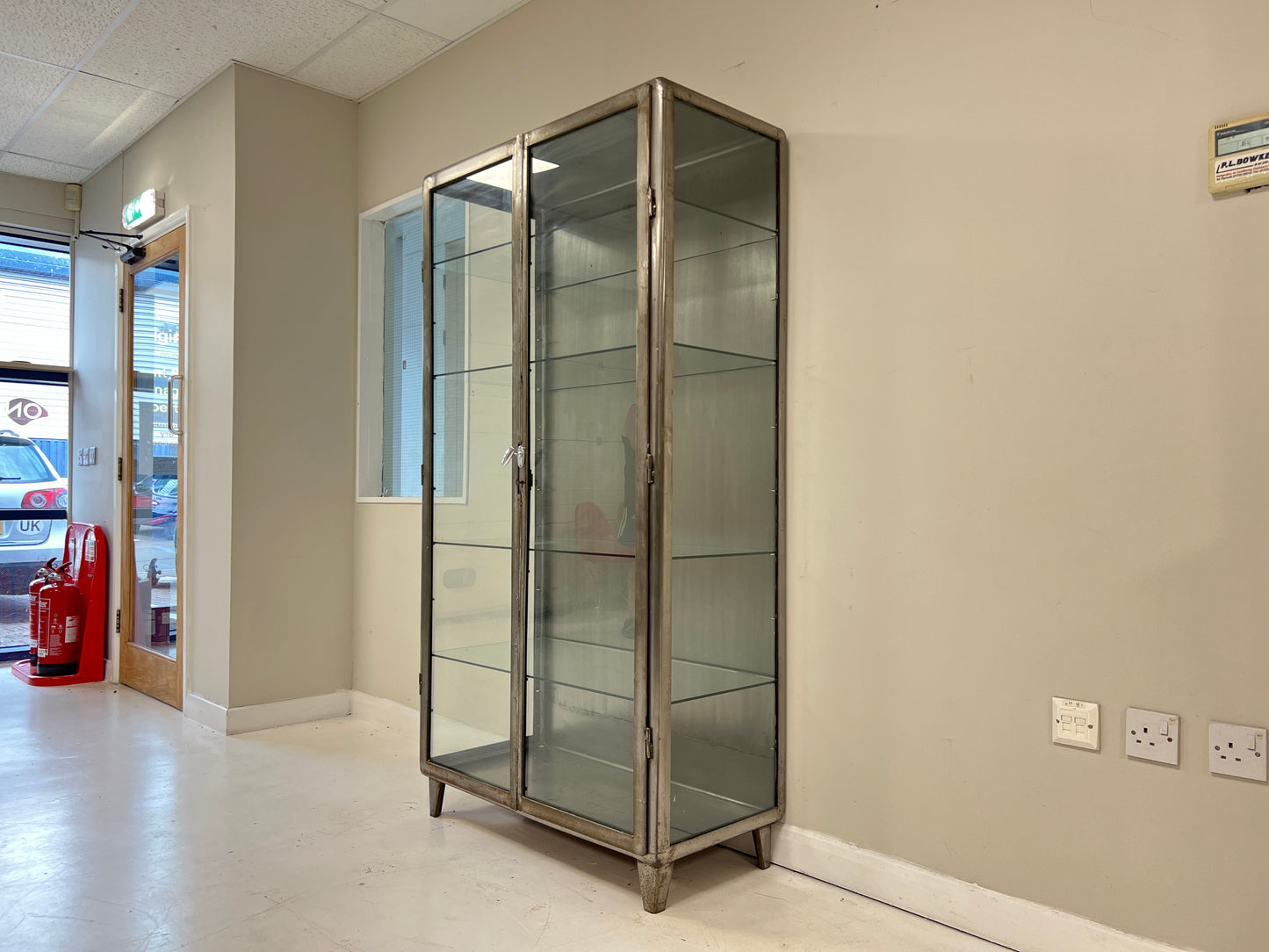 Vintage industrial steel and glass display cabinet detail