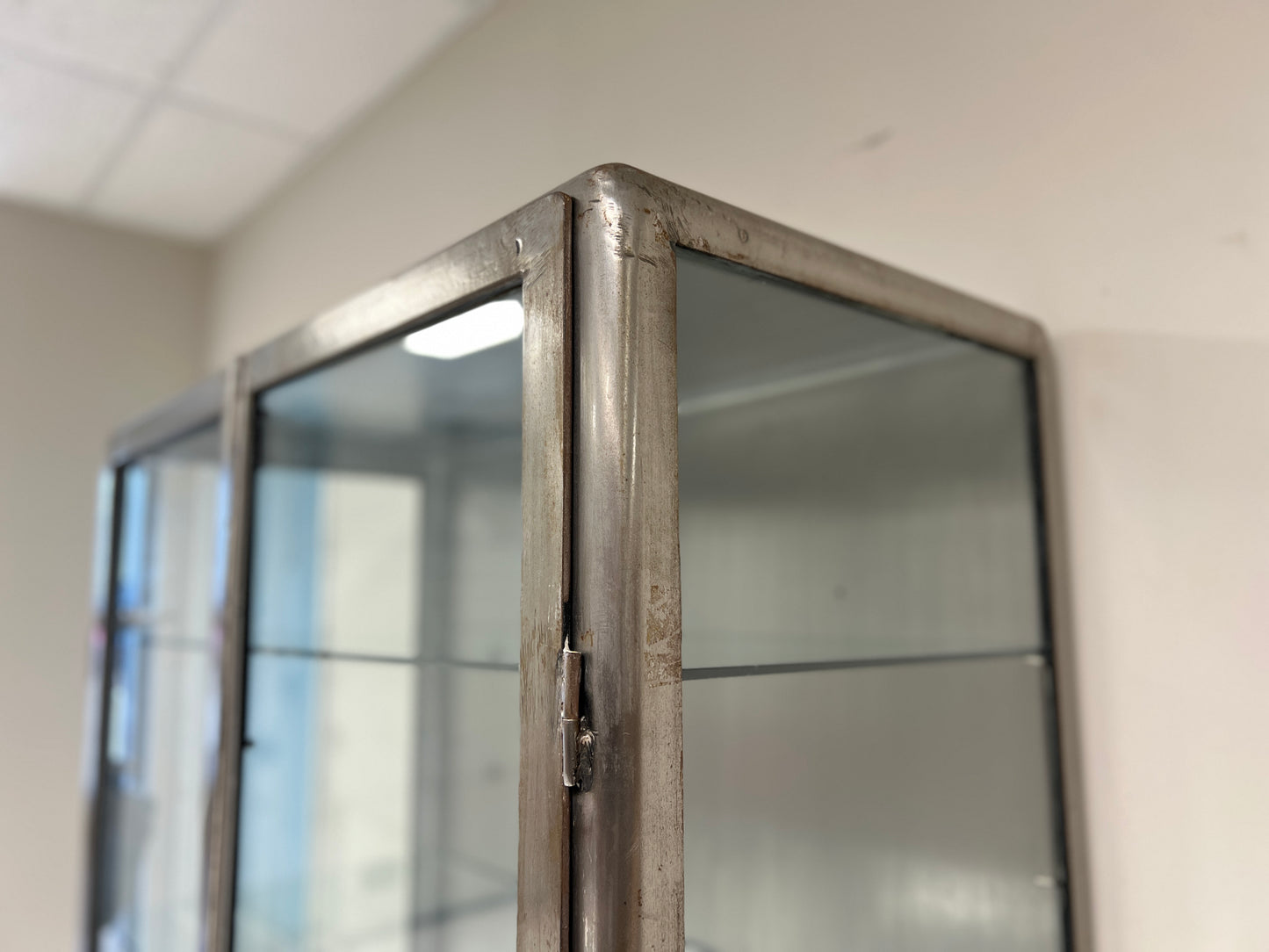 Vintage industrial steel and glass display cabinet detail