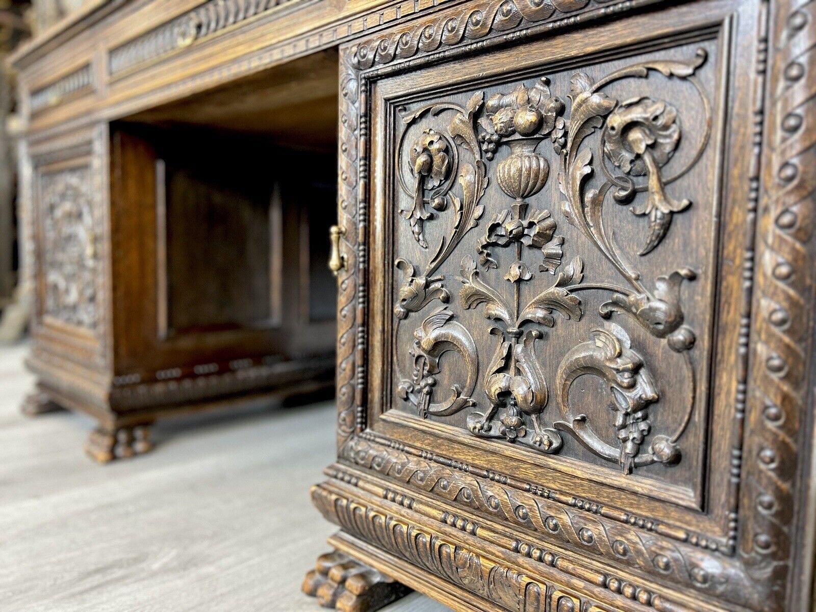 Carved oak antique desk detail available for prop and set hire from Hus & Home