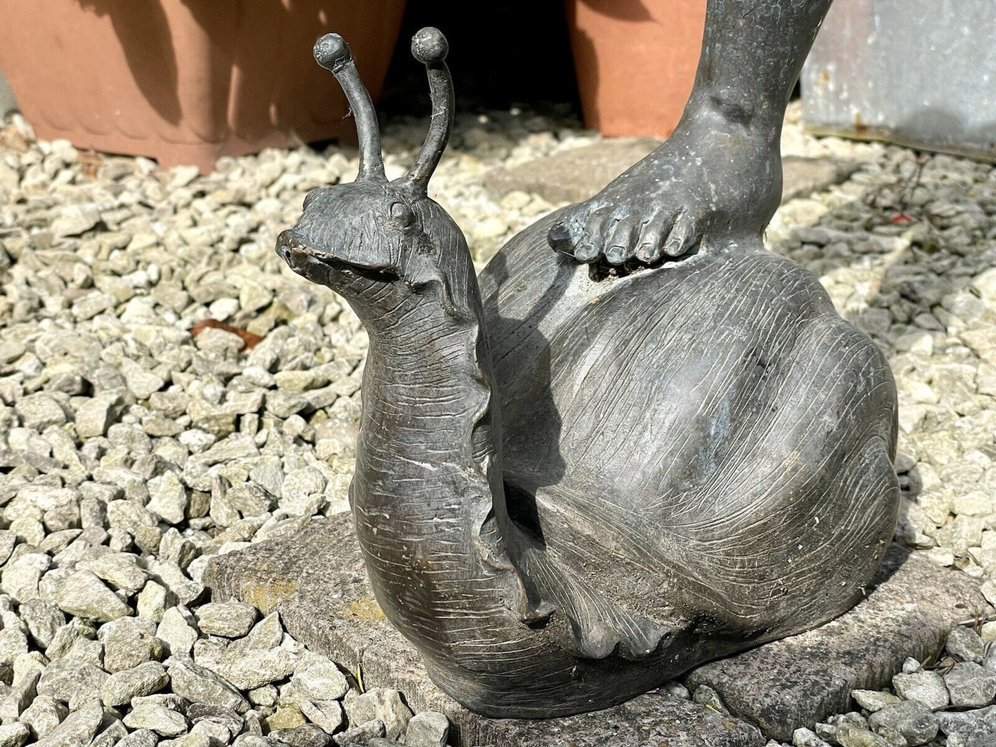 Bronzed Garden Water Feature of a Boy Stood on a Snail