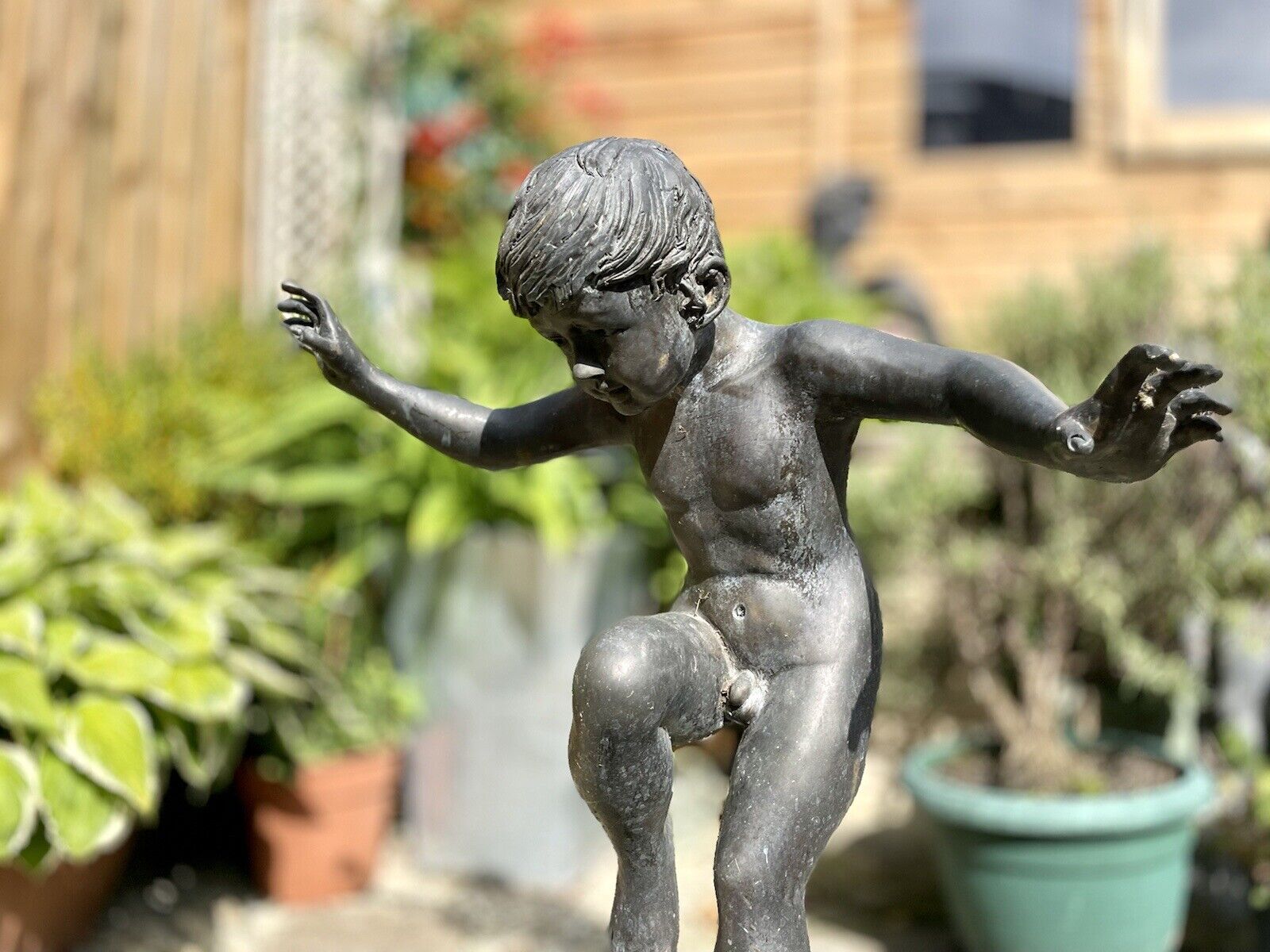 Bronzed Garden Water Feature of a Boy Stood on a Snail