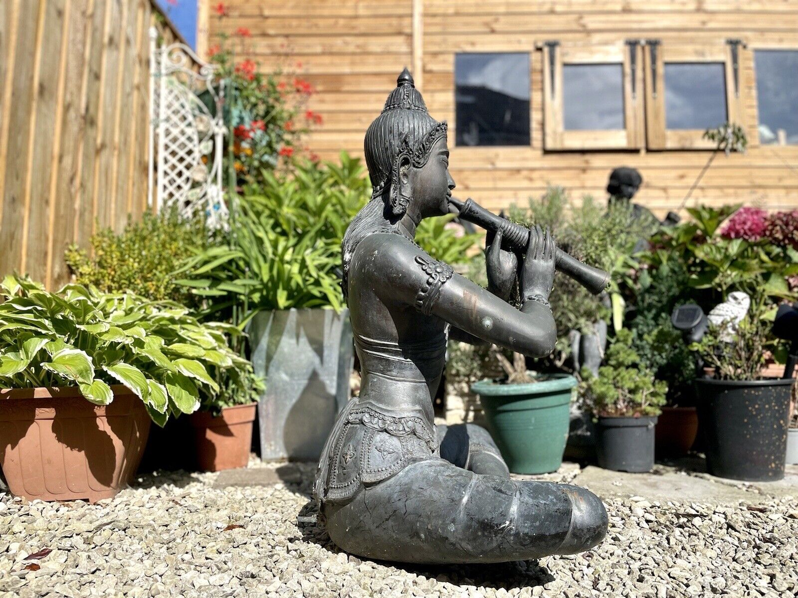 Bronzed Garden Water Feature of a Sitting Deity / Goddess Playing An Instrument